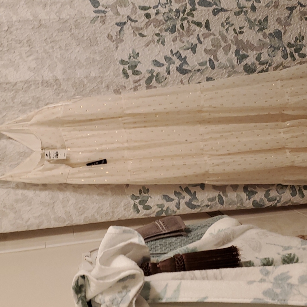A beautiful  white  dress  with  gold  in it.very cute maxi  dresses